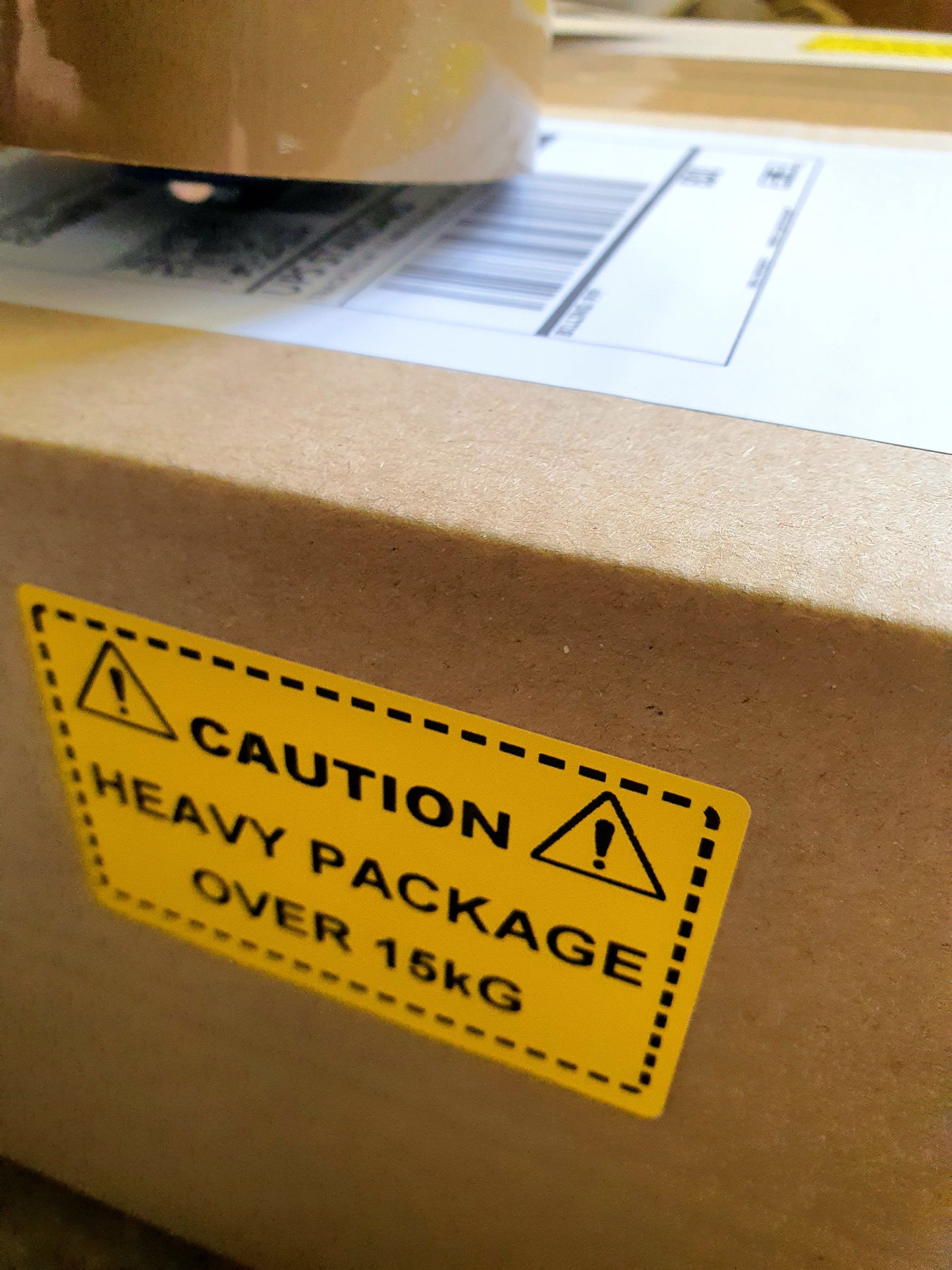 Caution Heavy Package Over 15kg Labels. 75 x 50mm