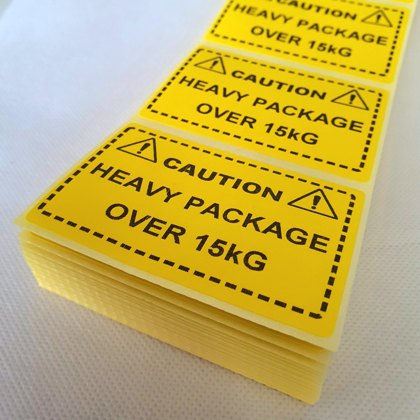 Caution Heavy Package Over 15kg Labels. 75 x 50mm